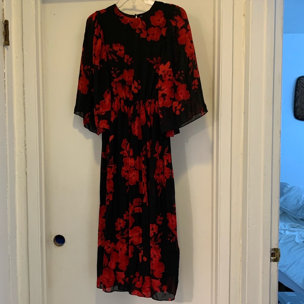 Black and red floral dress with pleating near the waistline